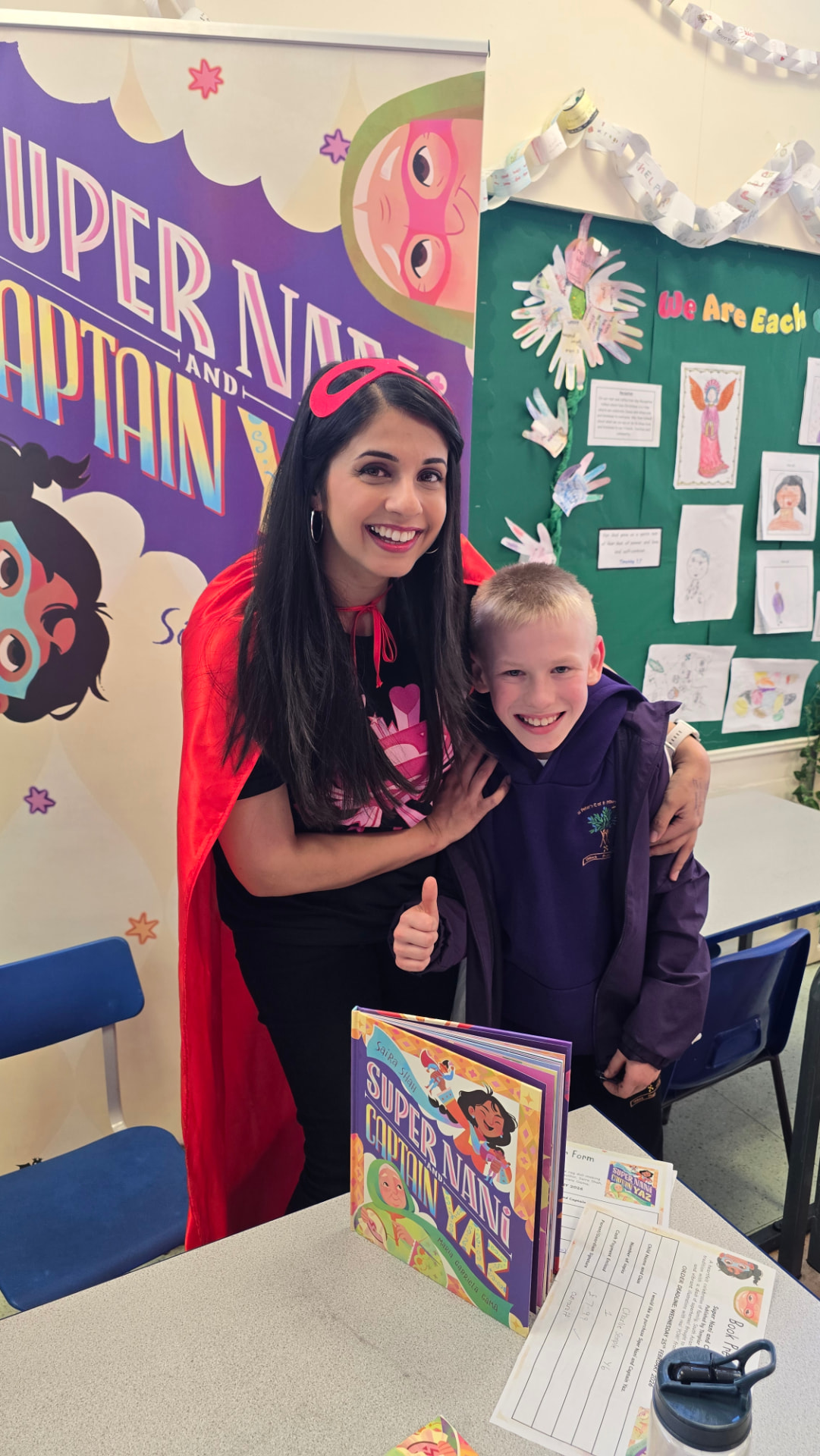 Saira Shah with a pupil at a book signing in Accrington